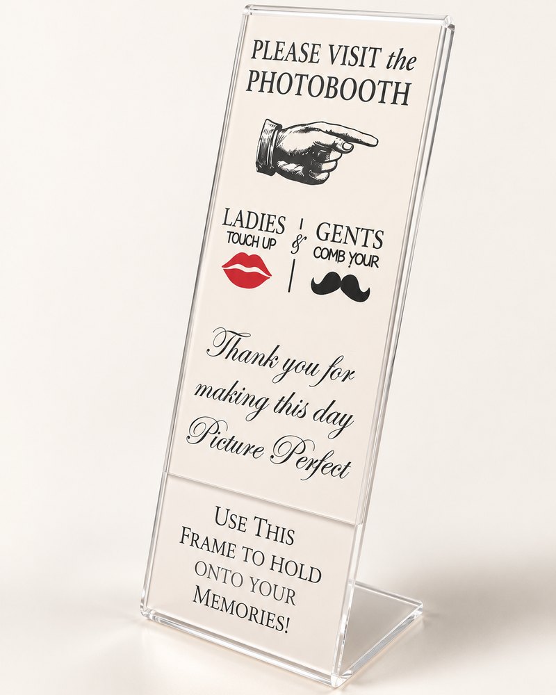 Clear acrylic photo strip stand with a custom photo booth sign